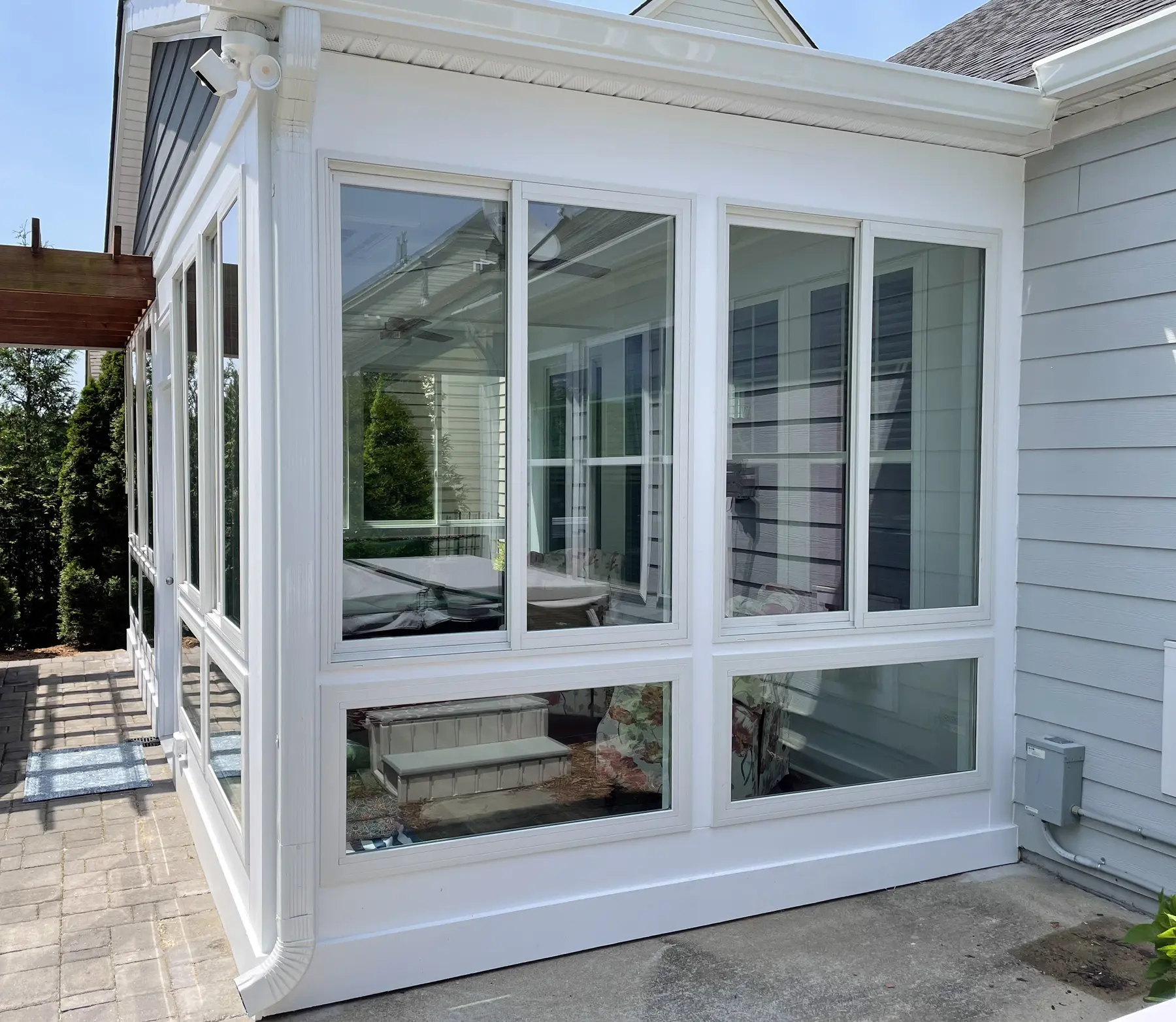 Side view showing the addition's full-height corner windows