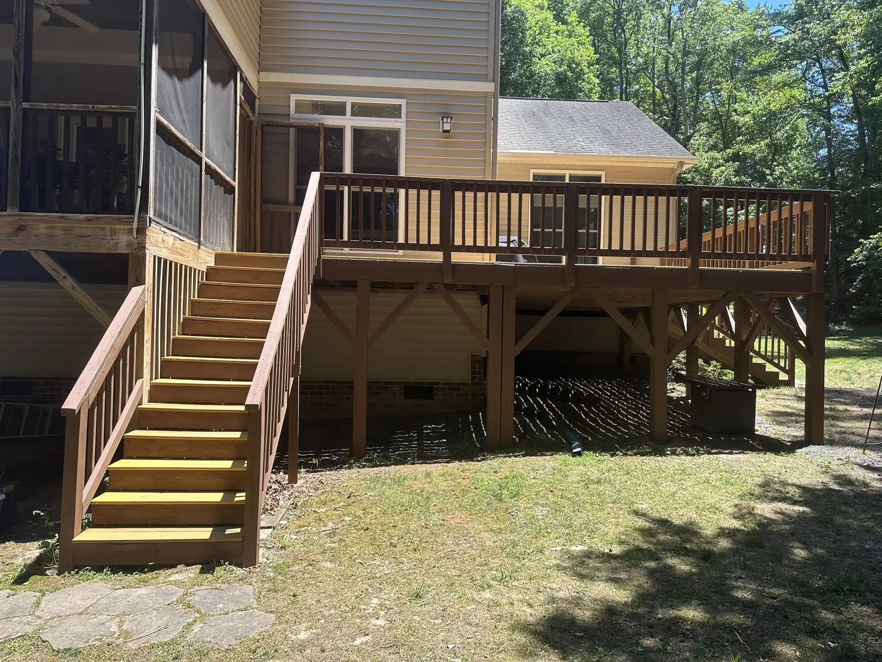Front view of the rebuilt deck, railing, and central stairs